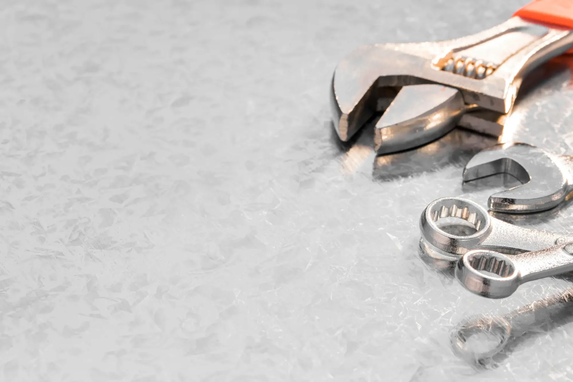 Appliance repair tools including wrenches on metal surface used by Tampa technicians