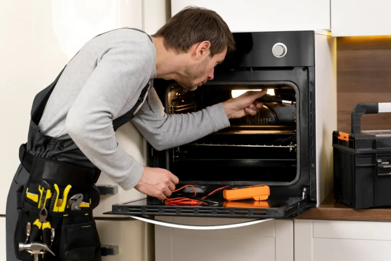 Appliance repair technician diagnosing heating issue inside residential oven in Tampa Bay